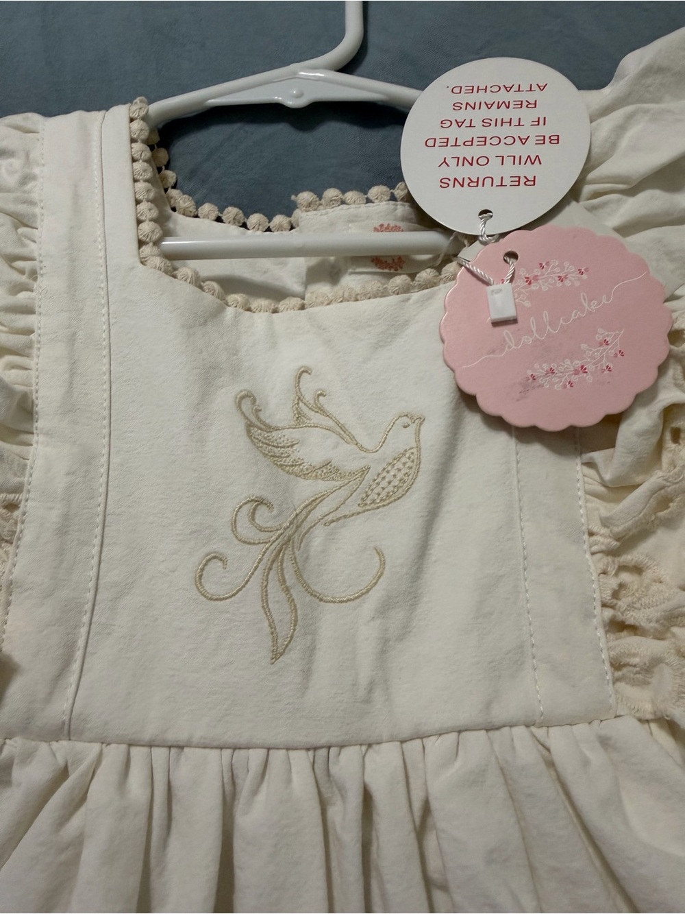 Adorable Cream Girls' Dress with Embroidered Dove -